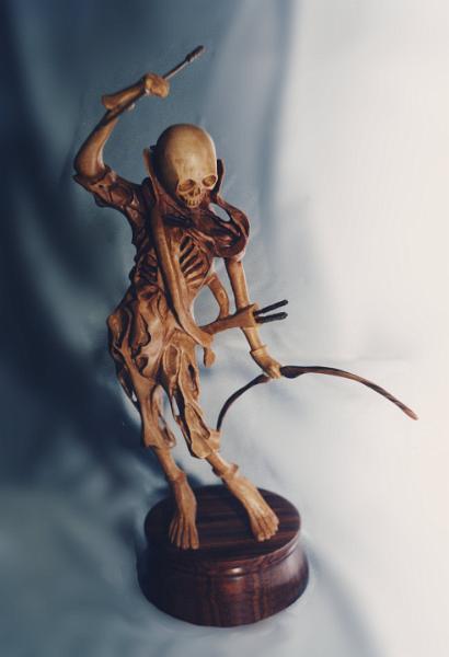 Skeleton.jpg - "Skeleton" - by Colin Etherington Lime - 13" high -   " My most ambitious piece yet."
